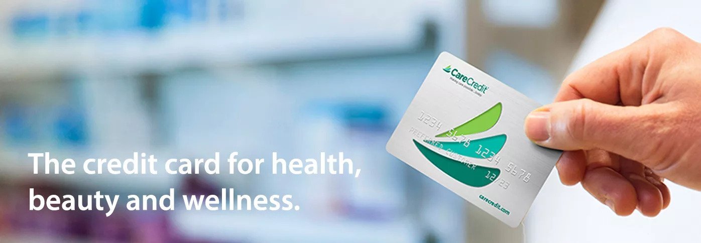 Hand holding the Care Credit Card Text reads The credit card for health, beauty and wellness